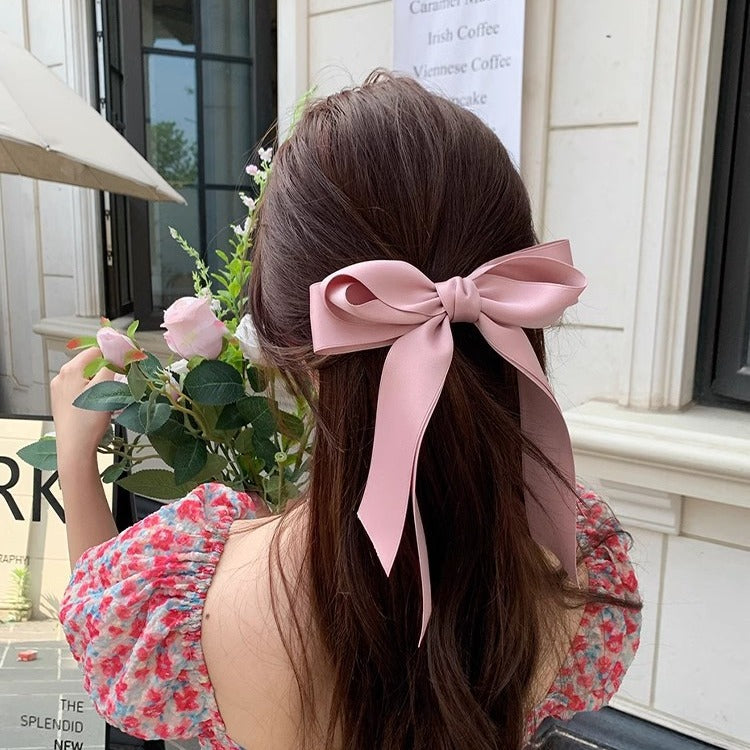 Girl hiding versatile bow ribbon hair clip