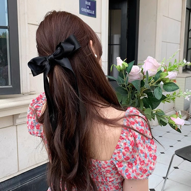 Girl hiding versatile bow ribbon hair clip