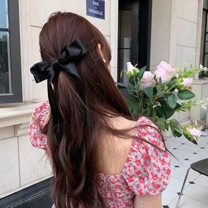 Girl hiding versatile bow ribbon hair clip