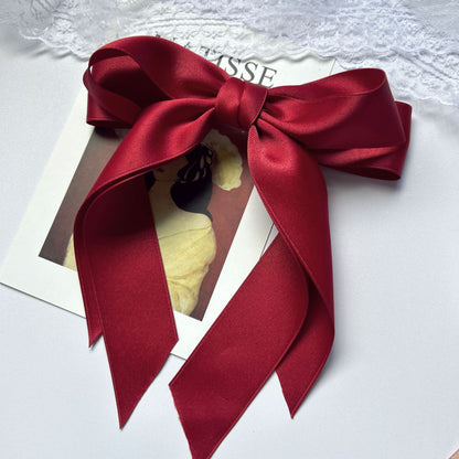 Girl hiding versatile bow ribbon hair clip